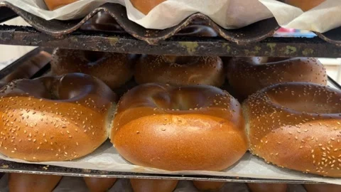 Freshly baked bread coming out of a bakery oven Stock Footage 295506226