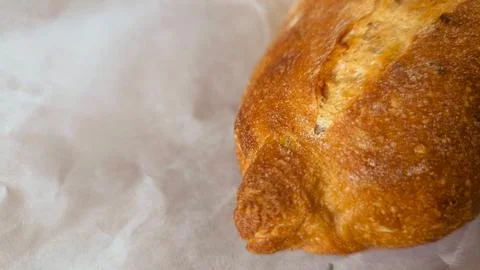 Freshly baked bread conceptually on paper background conceptually. Stockfoto's