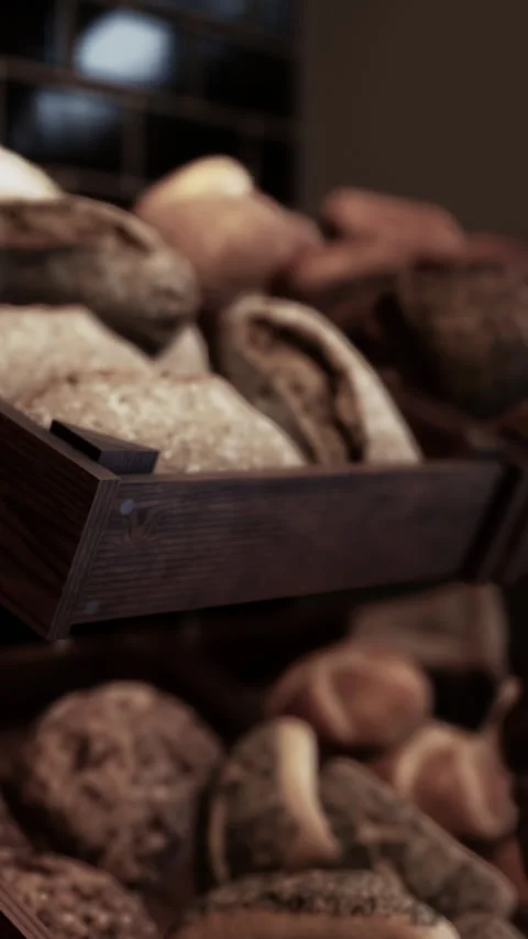 Freshly baked bread on display in a bakery during morning hours Stock Footage 339107802