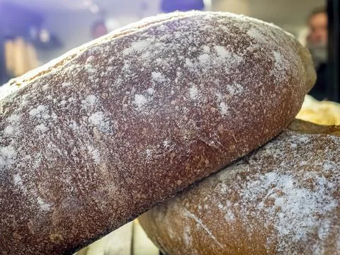 Freshly baked bread on display ready for sale in a local bakery Stock Photos