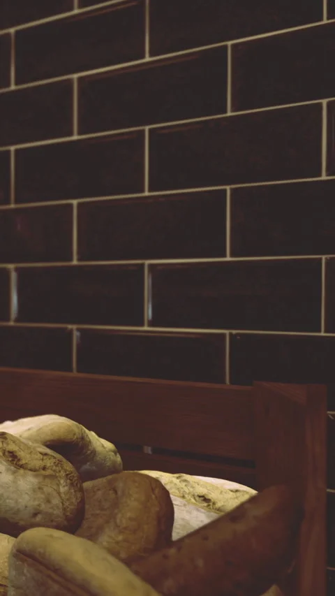 Freshly baked bread displayed in a bakery at morning time 스톡 동영상 331662473