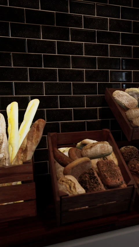 Freshly baked bread displayed at a bakery in the morning light Stock Footage 339104294