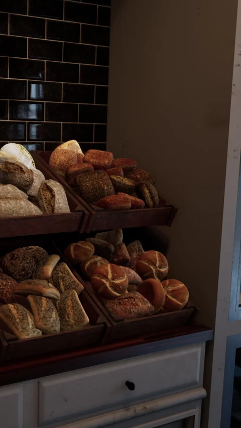 Freshly baked bread displayed in a bakery near a glass door at daytime Stock Footage 342192534