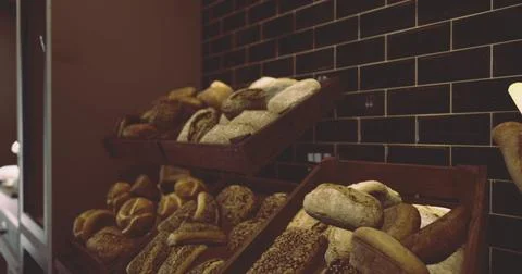 Freshly baked bread displayed at a local bakery during morning hours Stock Illustration