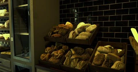 Freshly baked bread displayed in a rustic bakery setting Stock Illustration