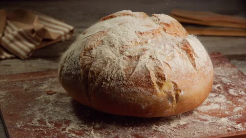 Freshly baked bread falling in slow motion Stock Footage 153465726