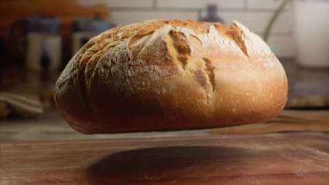 Freshly baked bread falling in slow motion Stock Footage 153465951