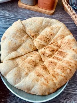 Freshly Baked Bread Loaf on Rustic Table 库存照片