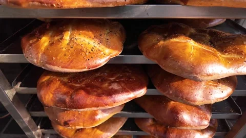 Freshly baked bread in local bakery captured during busy morning hours Stock Footage 347572250
