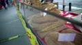 Freshly baked bread lying on the showcase at street market, crisis, high prices HD Footage