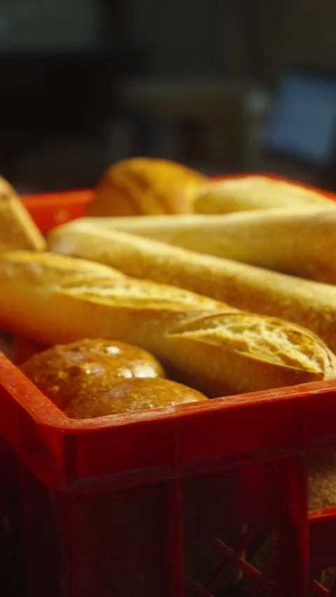 Freshly Baked Bread in Plastic Delivery Trays Close Up Stock Footage 345497194