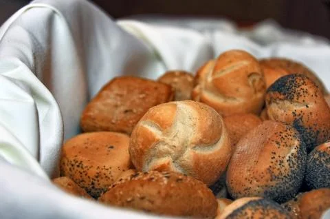 Freshly Baked Bread Rolls in a Basket Stock Photos
