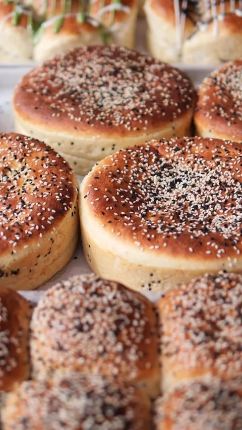 Freshly baked bread rolls at local market in autumn Stock Footage 336355148