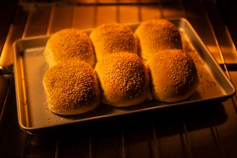 Freshly baked bread rolls in the oven Stock Photos