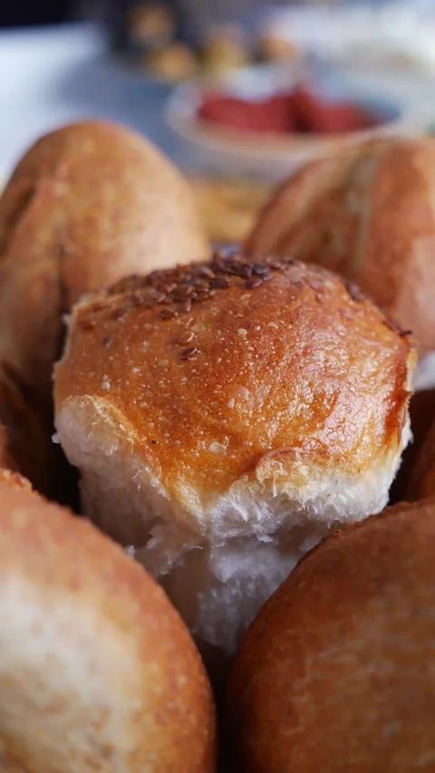 Freshly baked bread rolls on a table Stock Footage 341645407