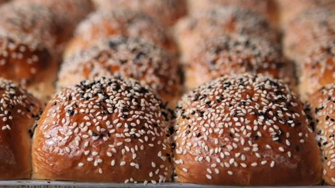 Freshly baked bread rolls on a tray Stock Footage 332751547