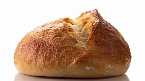 Freshly baked bread rotates on a white background, front view, stop motion. Video stock 148205321