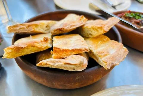 Freshly Baked Bread in a Rustic Bowl Stock Photos