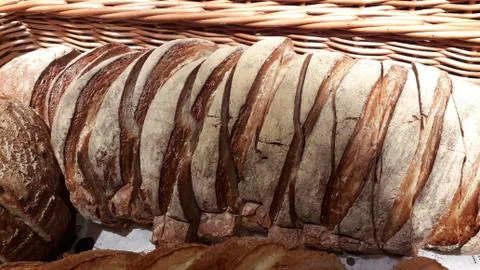 Freshly baked bread with scoring patterns Stock Photos
