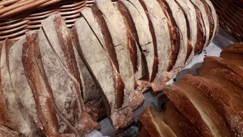 Freshly baked bread with scoring patterns Stock Photos