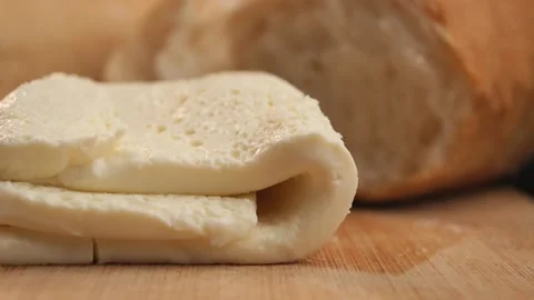 Freshly Baked Bread with a Soft Slice of Cheese Perfect for Any Meal Stock Footage 294660839