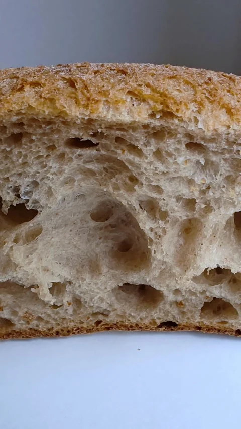 Freshly baked bread on white table, closeup. Stock-Footage 303464240
