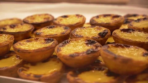 Freshly baked crunchy traditional portuguese dessert pastle de nata with custard Stock Footage