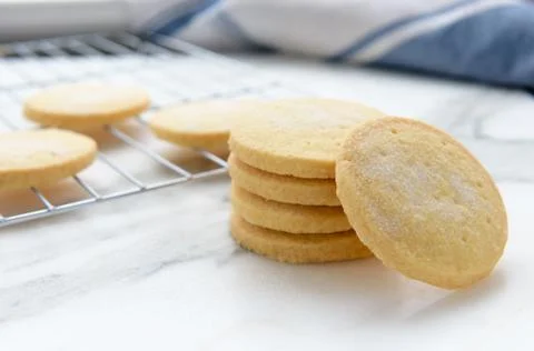 Freshly baked homemade butter shortbread biscuits dusted with sugar Stock Photos