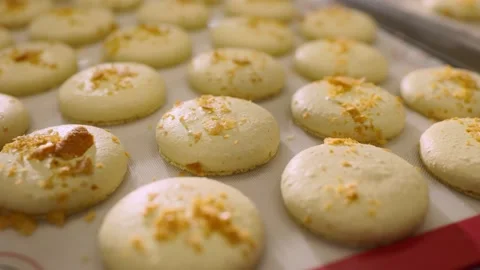 Freshly baked macaroons on a baking sheet. Stock Footage 233299311