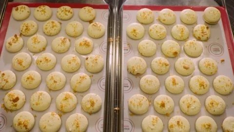 Freshly baked macaroons on a baking sheet. Stock Footage 233299331