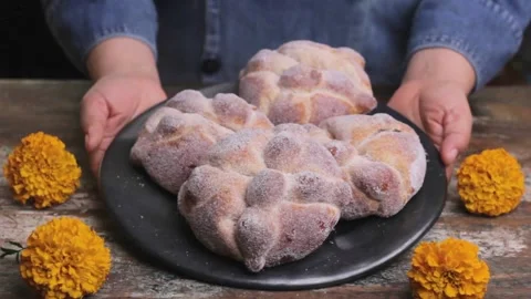 Freshly Baked Mexican Traditional Pan De Muerto Is Served On Day of the dead Stock Footage
