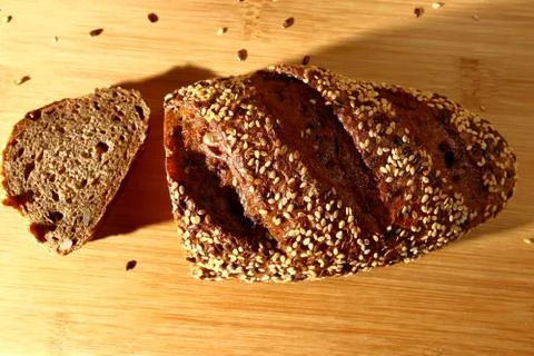 Freshly baked multigrain bread on rustic background, top view Stock Photos