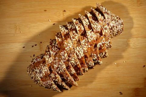 Freshly baked multigrain bread on rustic background, top view Stock Photos