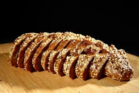 Freshly baked multigrain bread on rustic background, top view Stock Photos