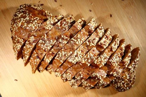 Freshly baked multigrain bread on rustic background, top view Stock Photos