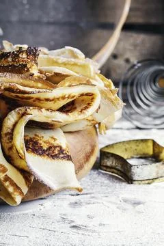 Freshly baked pancakes on a light background for the holiday carnival Stock Photos