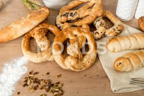 Freshly baked pastry products . Sesame pretzel and salty pastry pastry Stock Photos