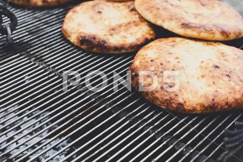 Freshly baked pitas at country fair outdoors Stock Photos