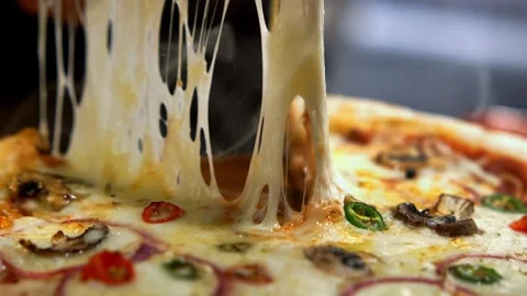 Freshly baked pizza slice pulled with melting mozzarella cheese strings and.. Video stock 337524635