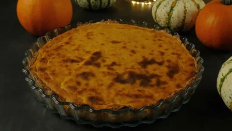 Freshly baked pumpkin pie on a gray background. Pumpkins and Pie Stock Footage 160570822