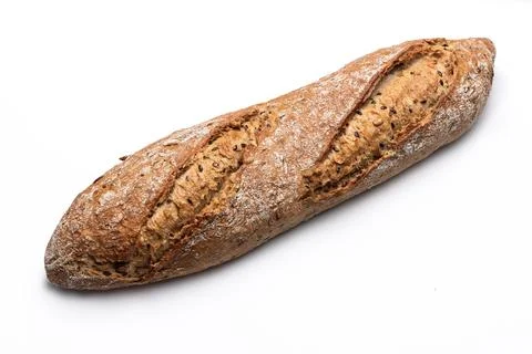 Freshly baked rustic bread baguette with seeds isolated on white background 库存照片