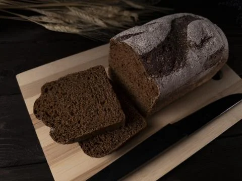 Freshly baked rustic bread with slices Stock Photos