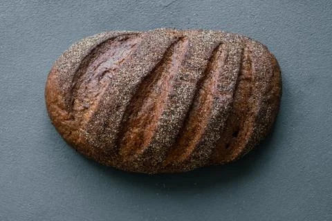 Freshly baked rustic bread on the table Stock Photos