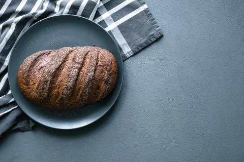 Freshly baked rustic bread on the table Stock Photos