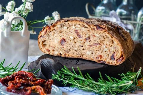 Freshly baked rye bread with seeds and raisins on sourdough without yeast wit Stock Photos