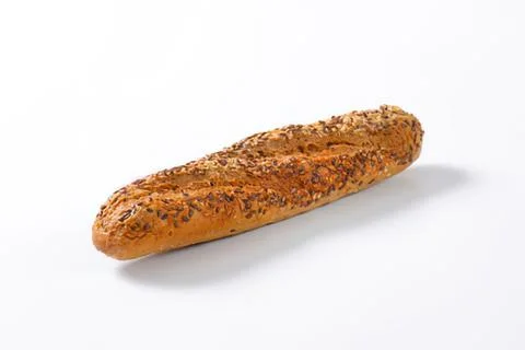 Freshly baked seed bread on plain surface Stock Photos