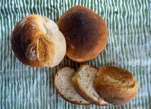 Freshly baked sliced bread on the table closeup. Stock Photos