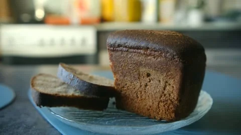 Freshly baked sliced rye bread on plate Stock Footage 337893521