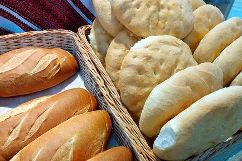 Freshly Baked Wheat Bread Displayed in a Rustic Basket at a Local Market Du.. Stock Photos