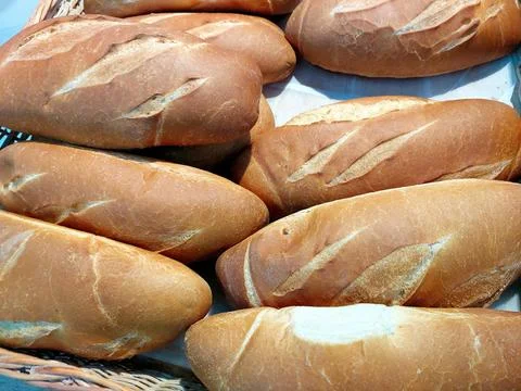 Freshly Baked Wheat Bread Rolls in a Rustic Basket From a Local Bakery in t.. Stock Photos